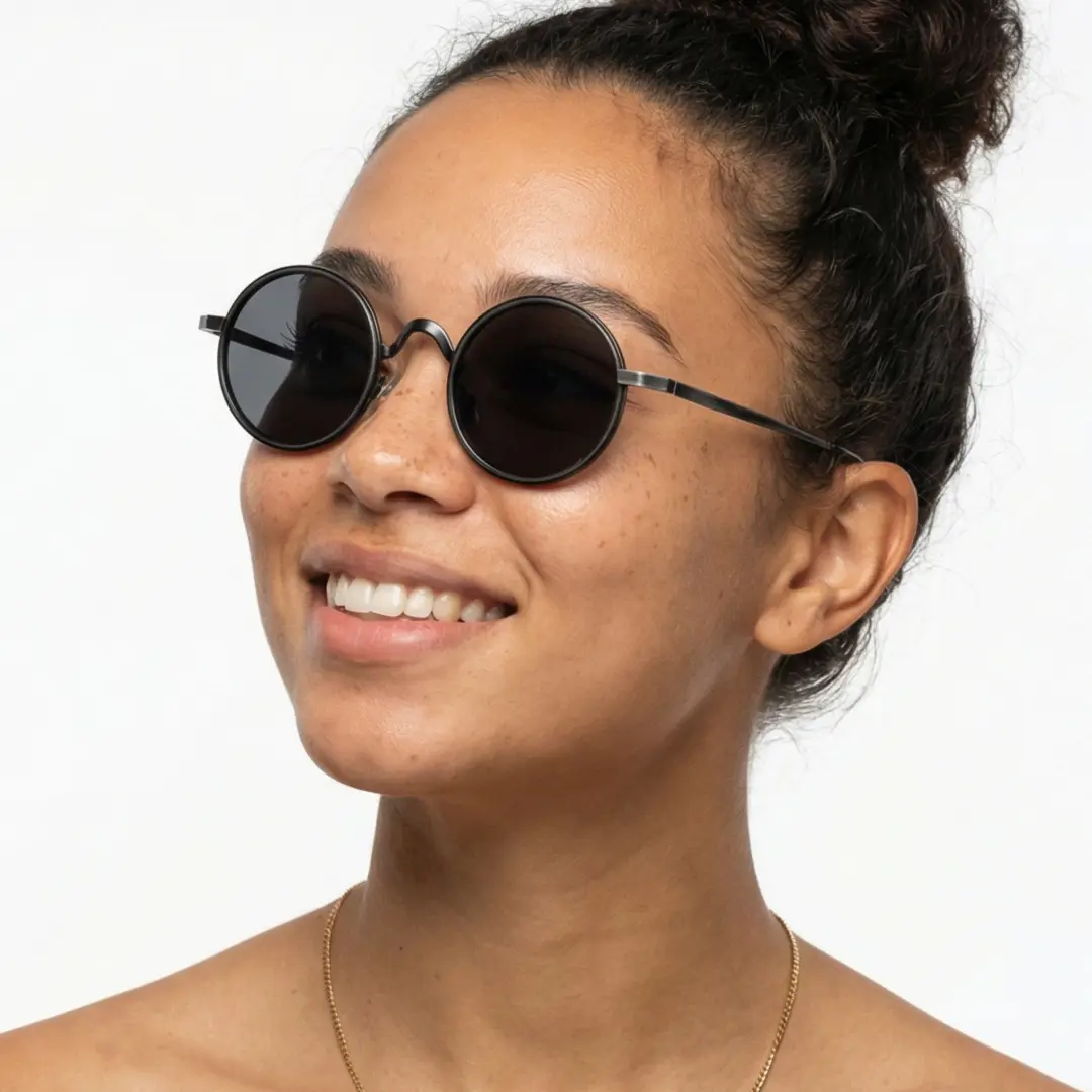 Looking away view of female wearing black round sunglasses, friendly smile, RM0162506
