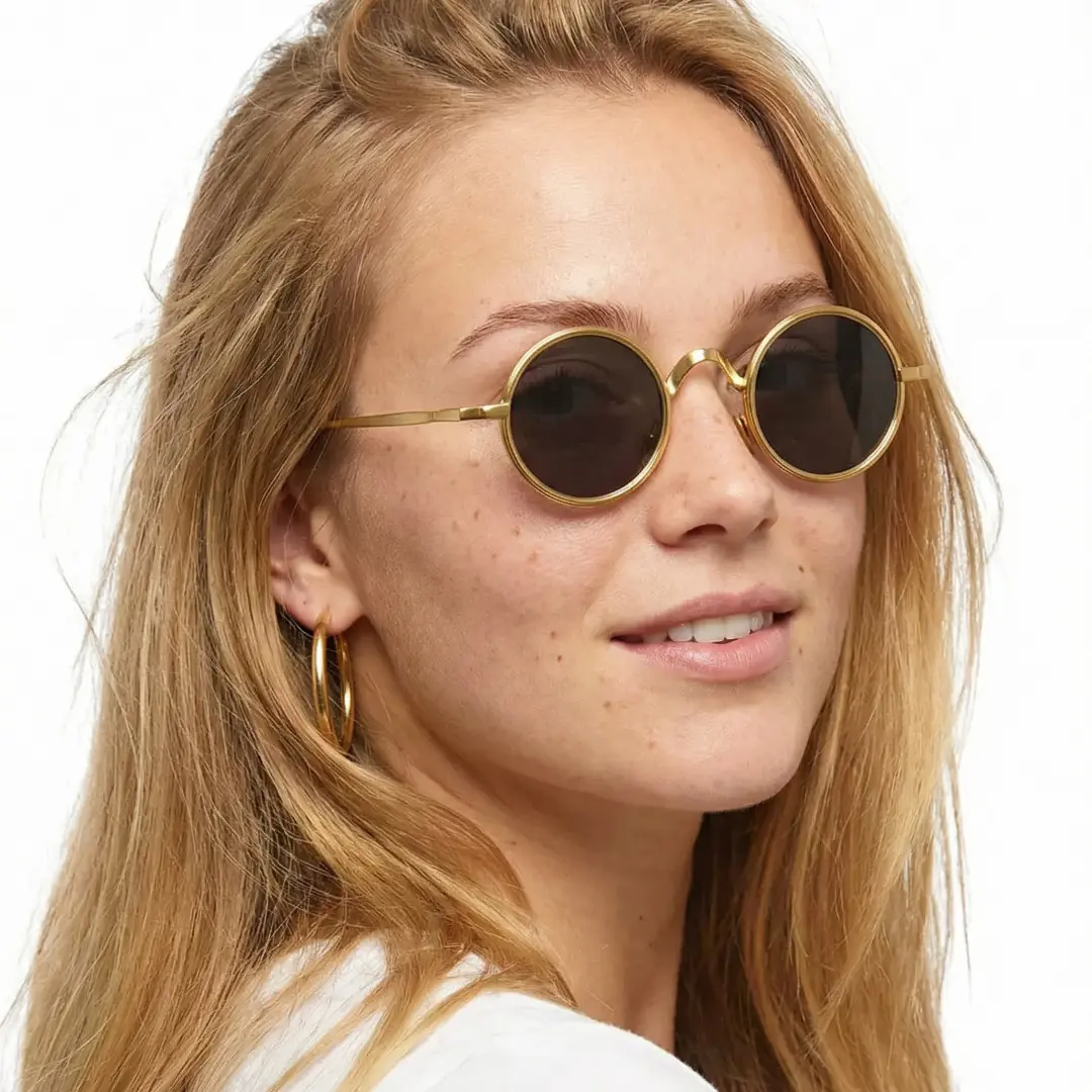 Over-the-shoulder view of female wearing gold round sunglasses, natural expression, RM0162506