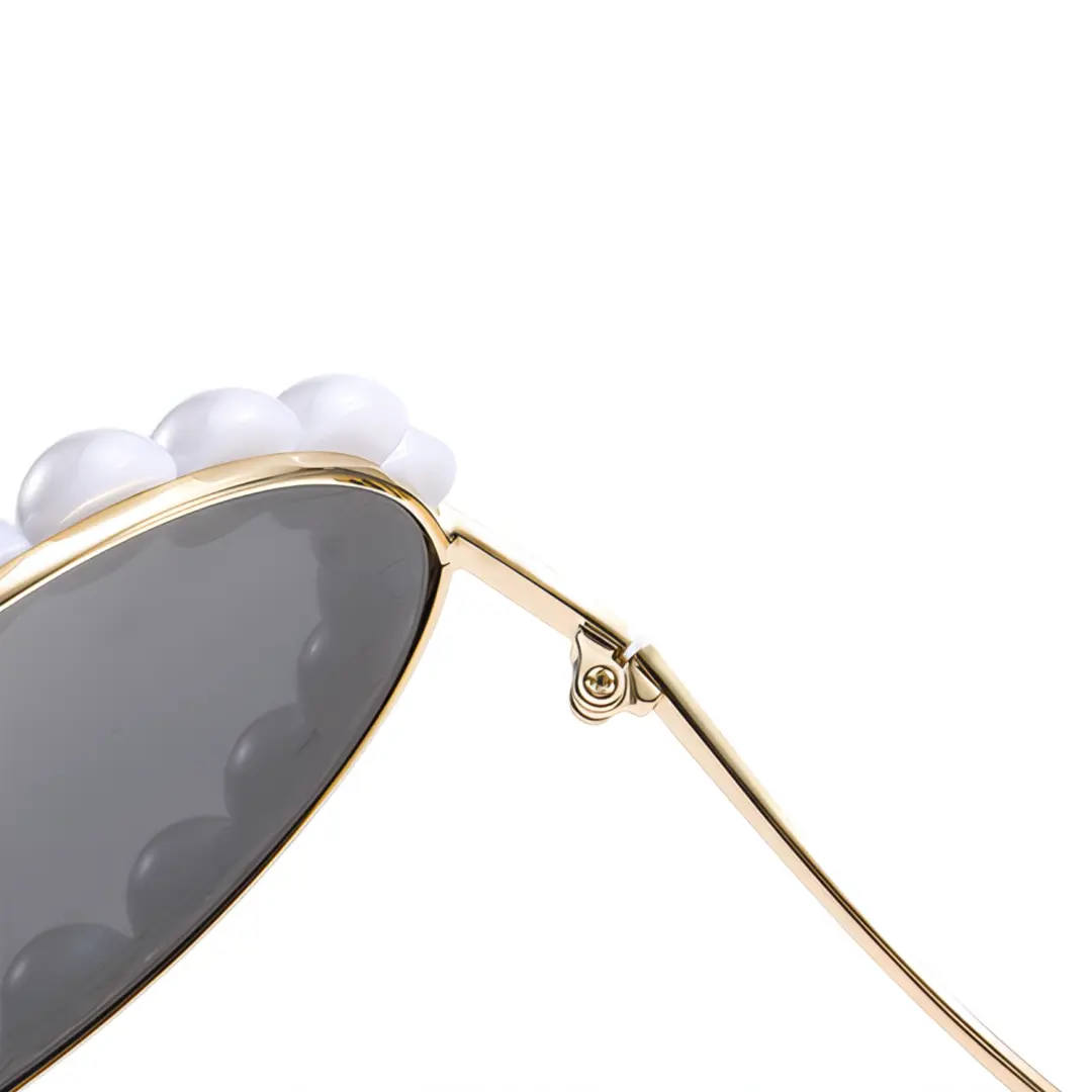 Hinge detail of Kiara vintage round metal sunglasses in gold. SPU: RM0202507