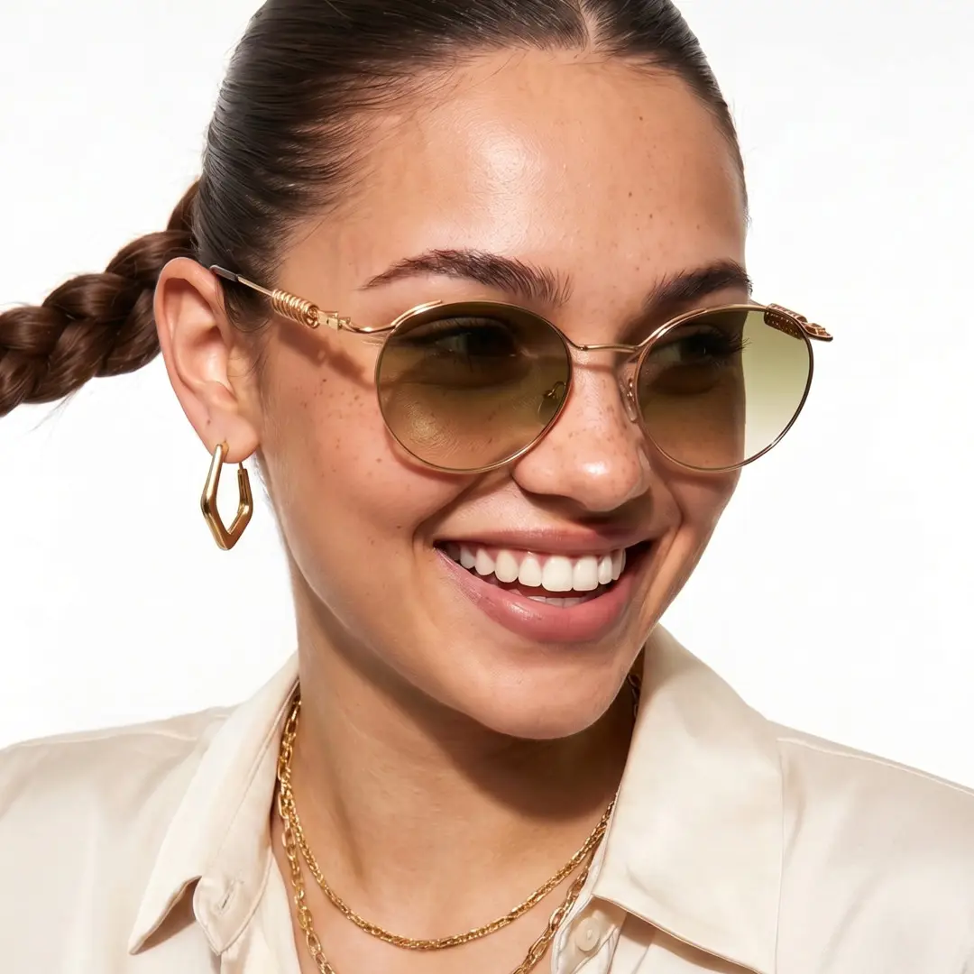 Slightly angled view of female wearing steampunk brown round sunglasses, smiling, RM0262603