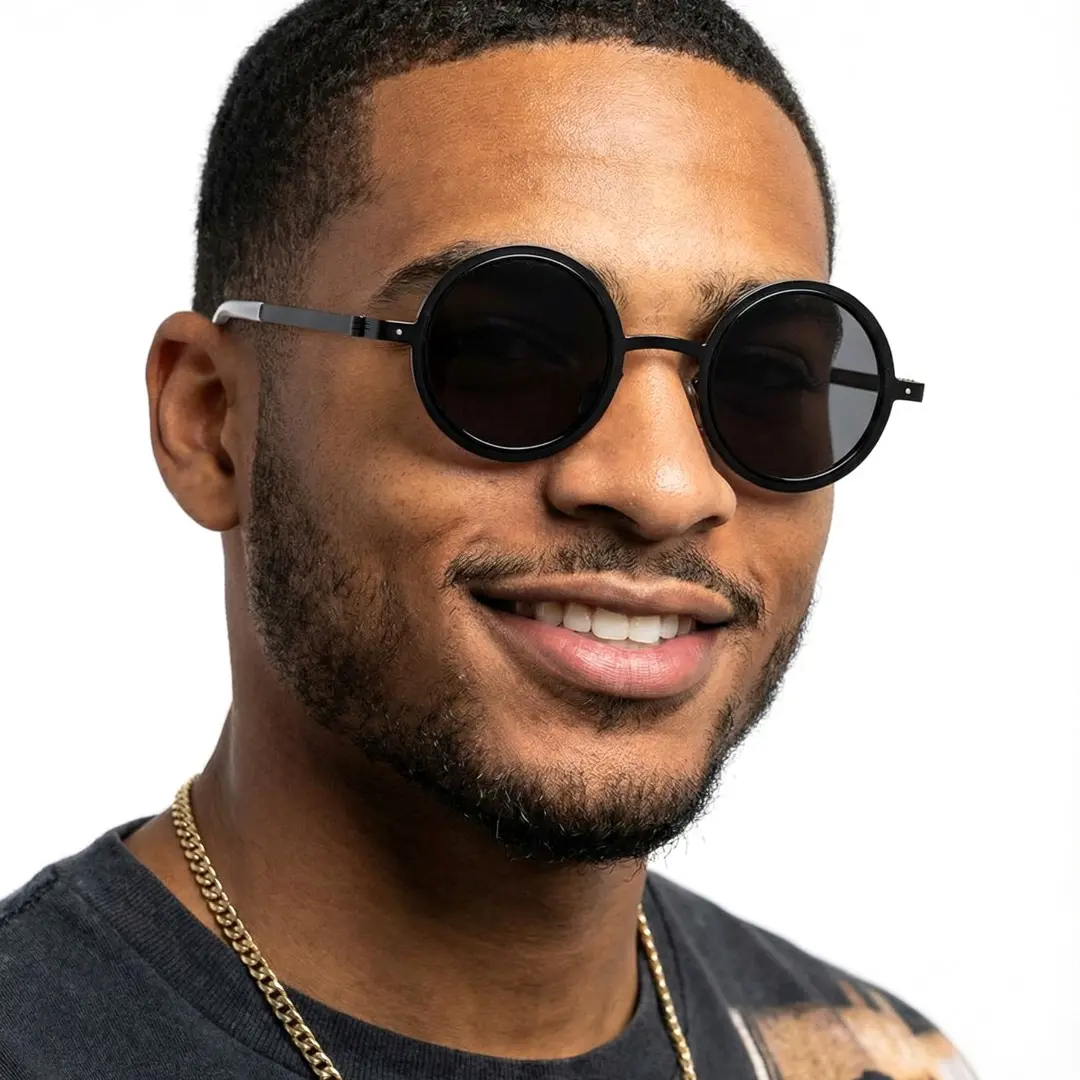 Front view of male wearing black round ND filter sunglasses, natural smile, RM0322507