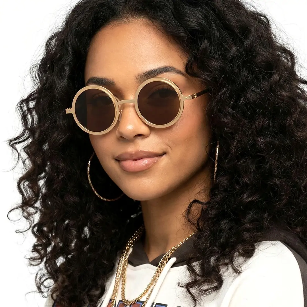 Face close-up view of female wearing steampunk gold round sunglasses, neutral expression, RM0322507