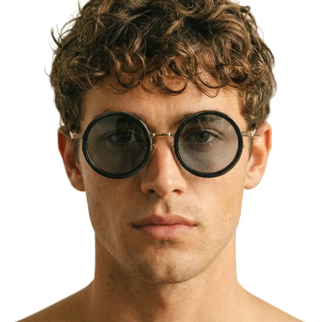 Front view of male wearing steampunk gold round magnetic clip-on sunglasses set with interchangeable clip-on lenses, neutral expression, RM0382507