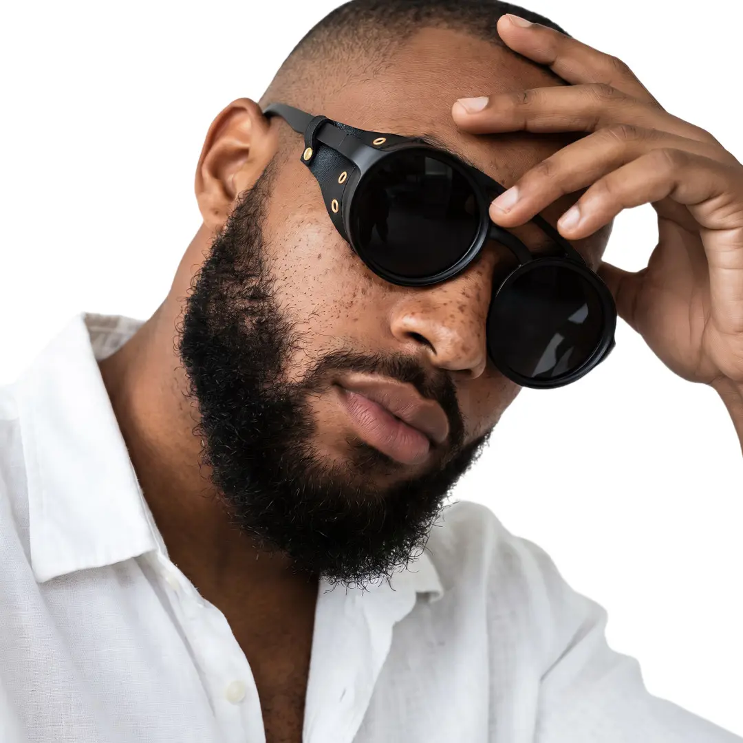 Front view of male wearing steampunk black round sunglasses, tilting head, neutral expression, RP0082604