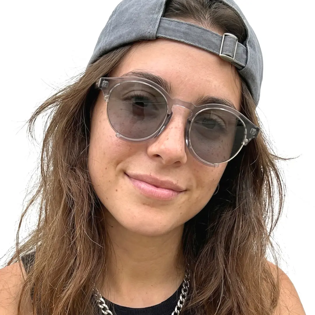 Slightly angled view of female wearing grey round sunglasses, natural expression, RR0062402