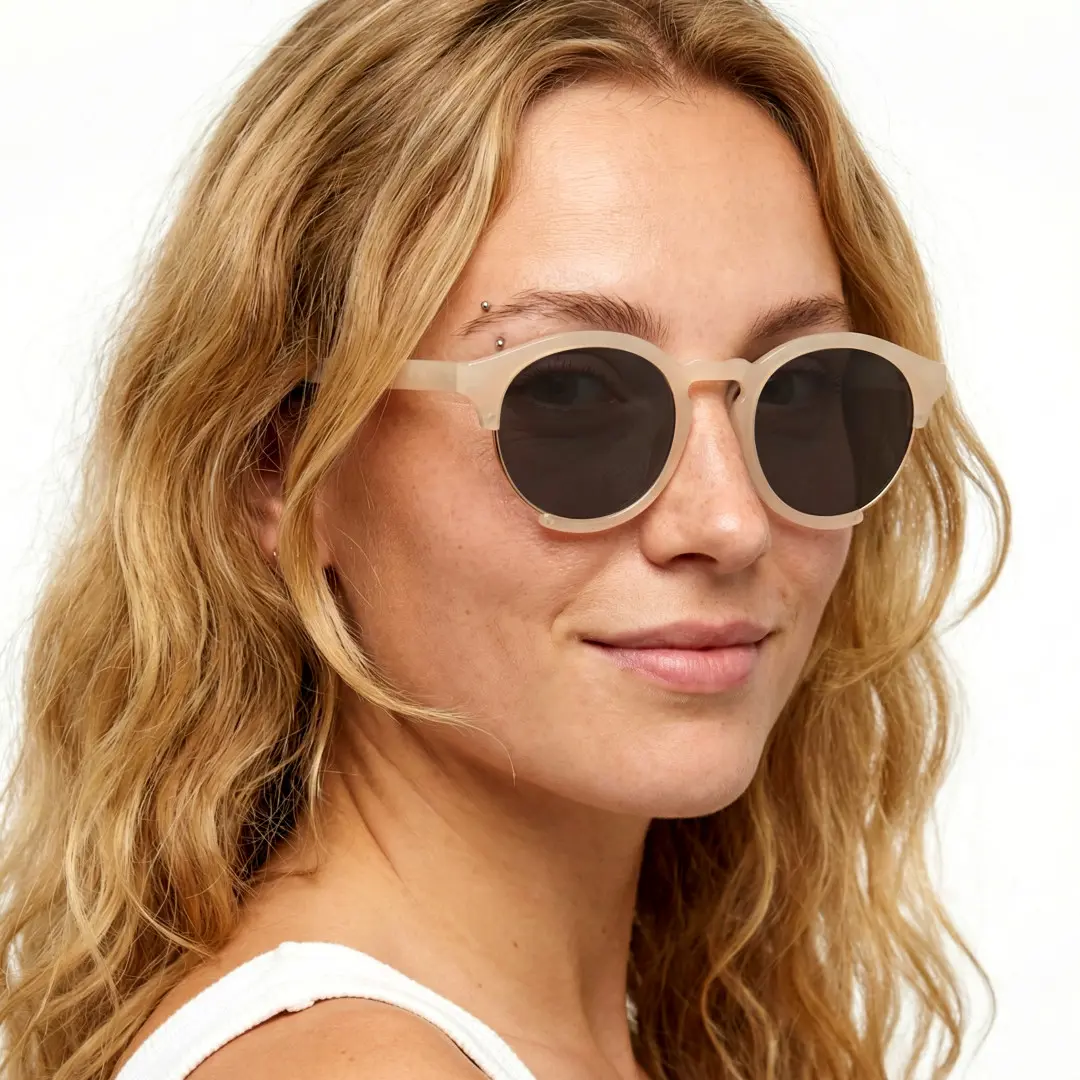 Profile view of female wearing pink round sunglasses, neutral expression, RR0062402
