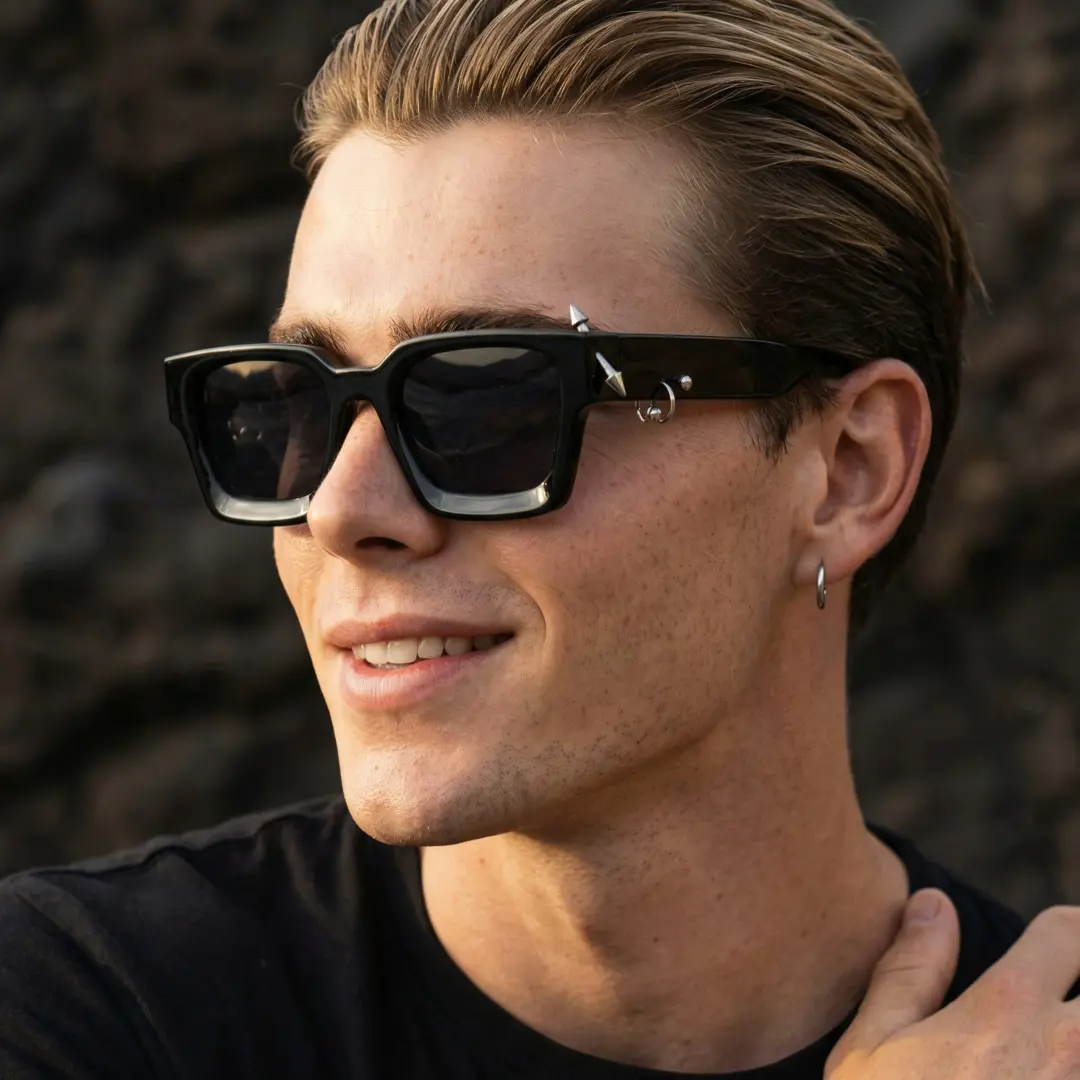 Three-quarter view of male wearing black square sunglasses, natural smile, SP0012603