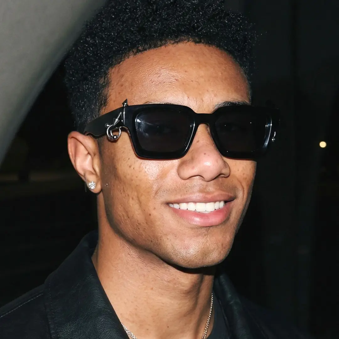 Front view of male wearing black square sunglasses, smiling, SP0012603