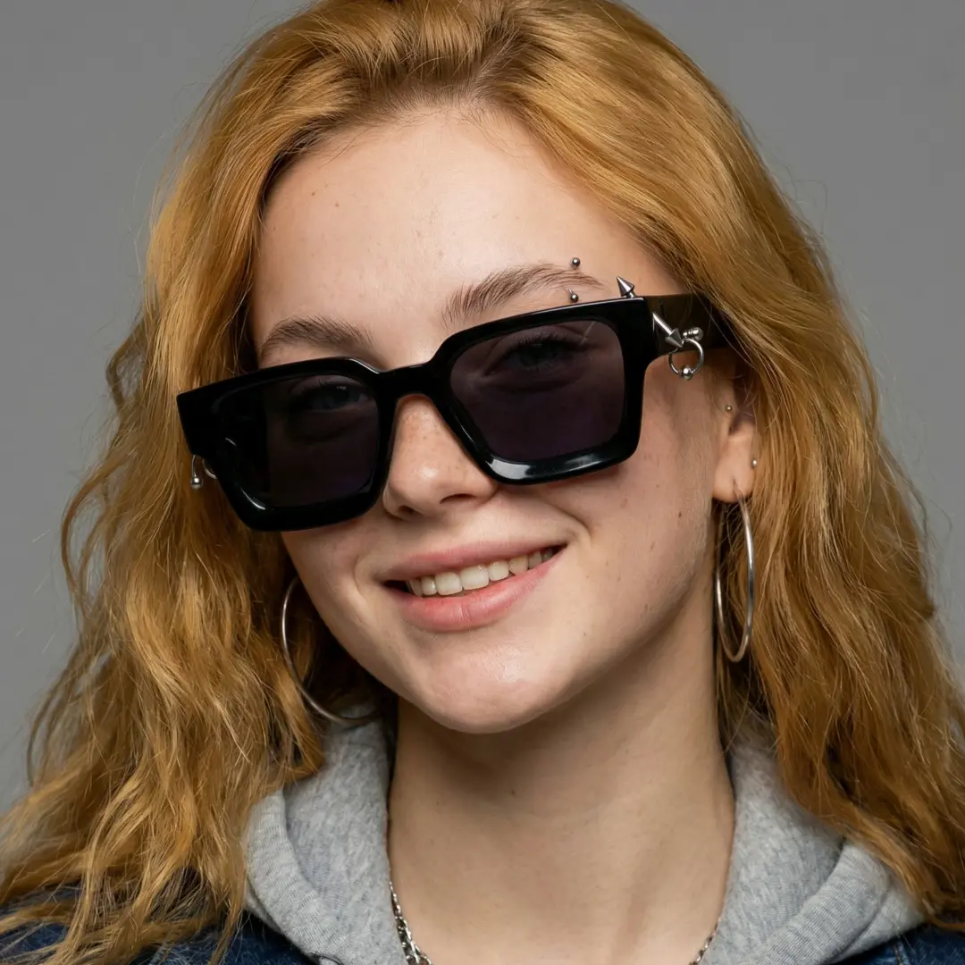 Front view of female wearing black square sunglasses, tilting head, natural smile, SP0012603