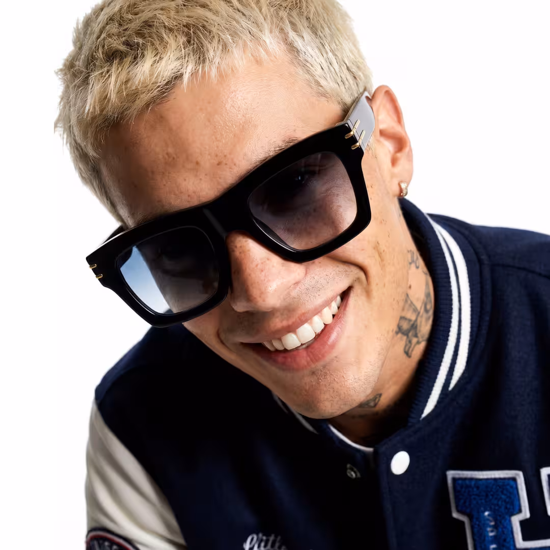 Close-up view of male wearing black square sunglasses, smiling, SP0052605