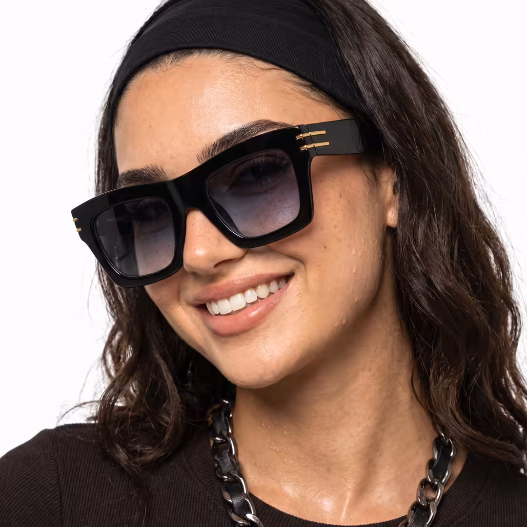 Female wearing black square pc sunglasses, smiling. SPU: SP0052605