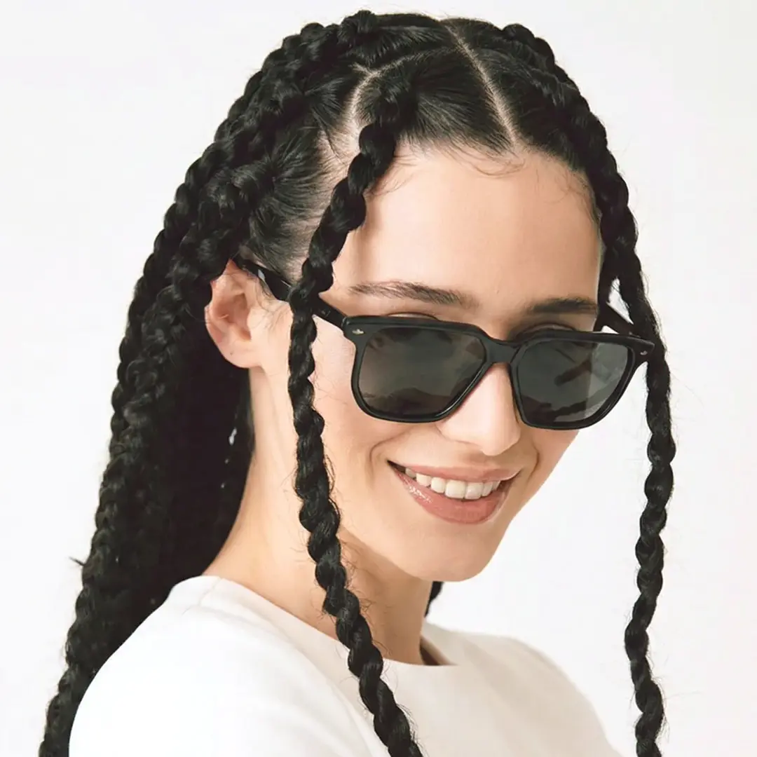 Three-quarter view of female wearing black square sunglasses, natural smile, SP0142506