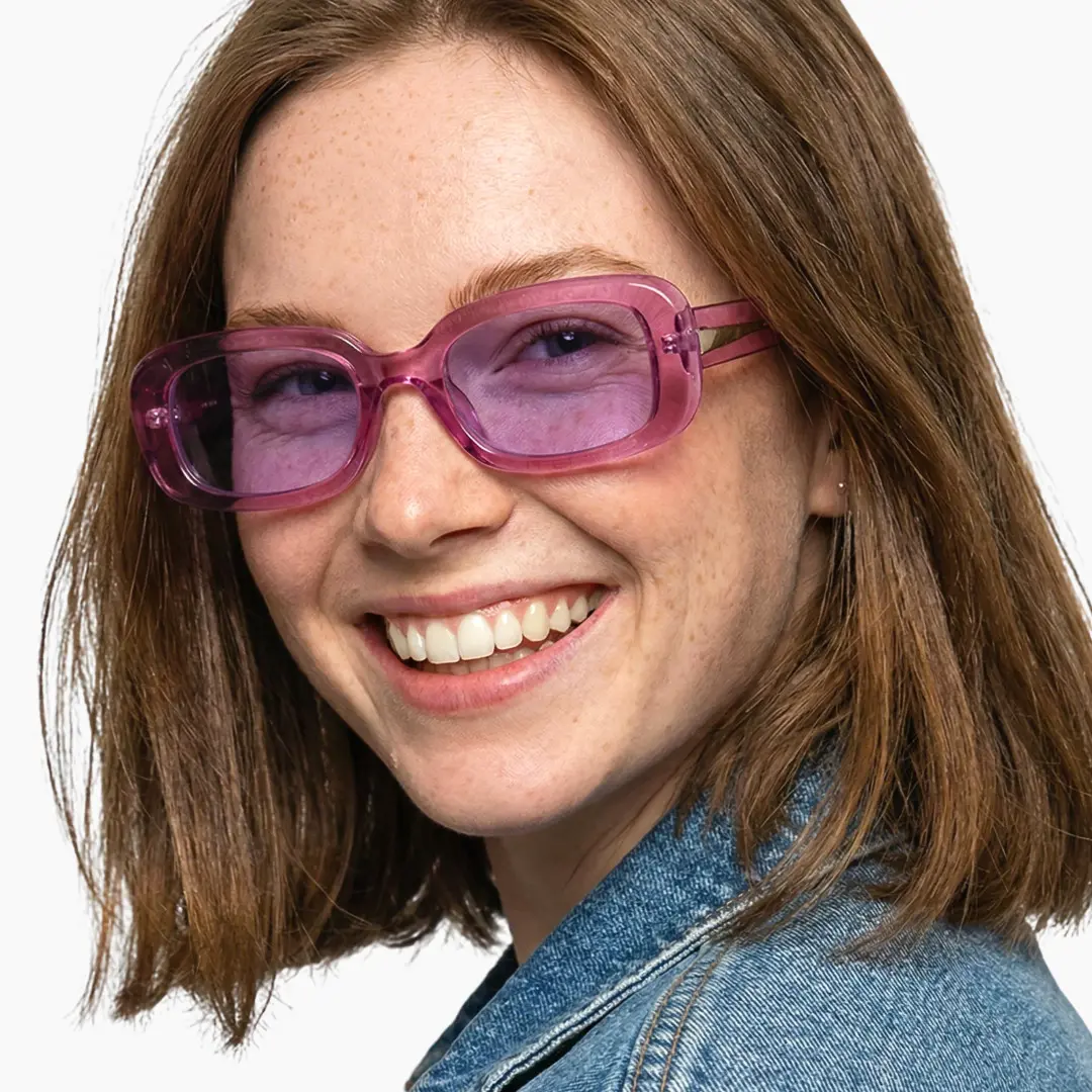 Profile view of female wearing pink rectangle sunglasses, big smile, SP0182507