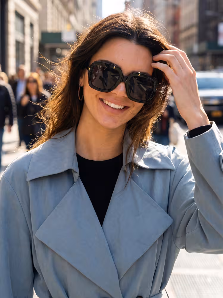 Female model wearing vintage black square pc eyeglasses on a busy sunny city street. SPU: SP0192603
