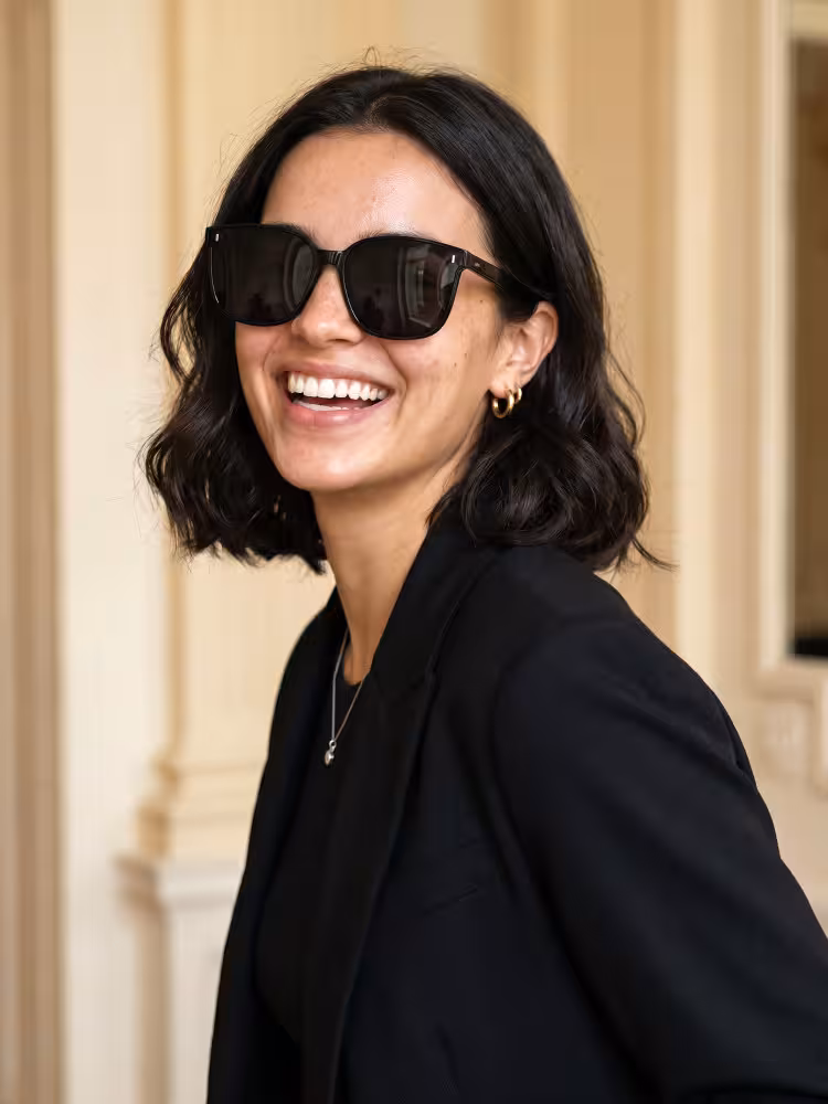 Female model wearing vintage black square pc sunglasses in a classic interior setting. SPU: SP0302604