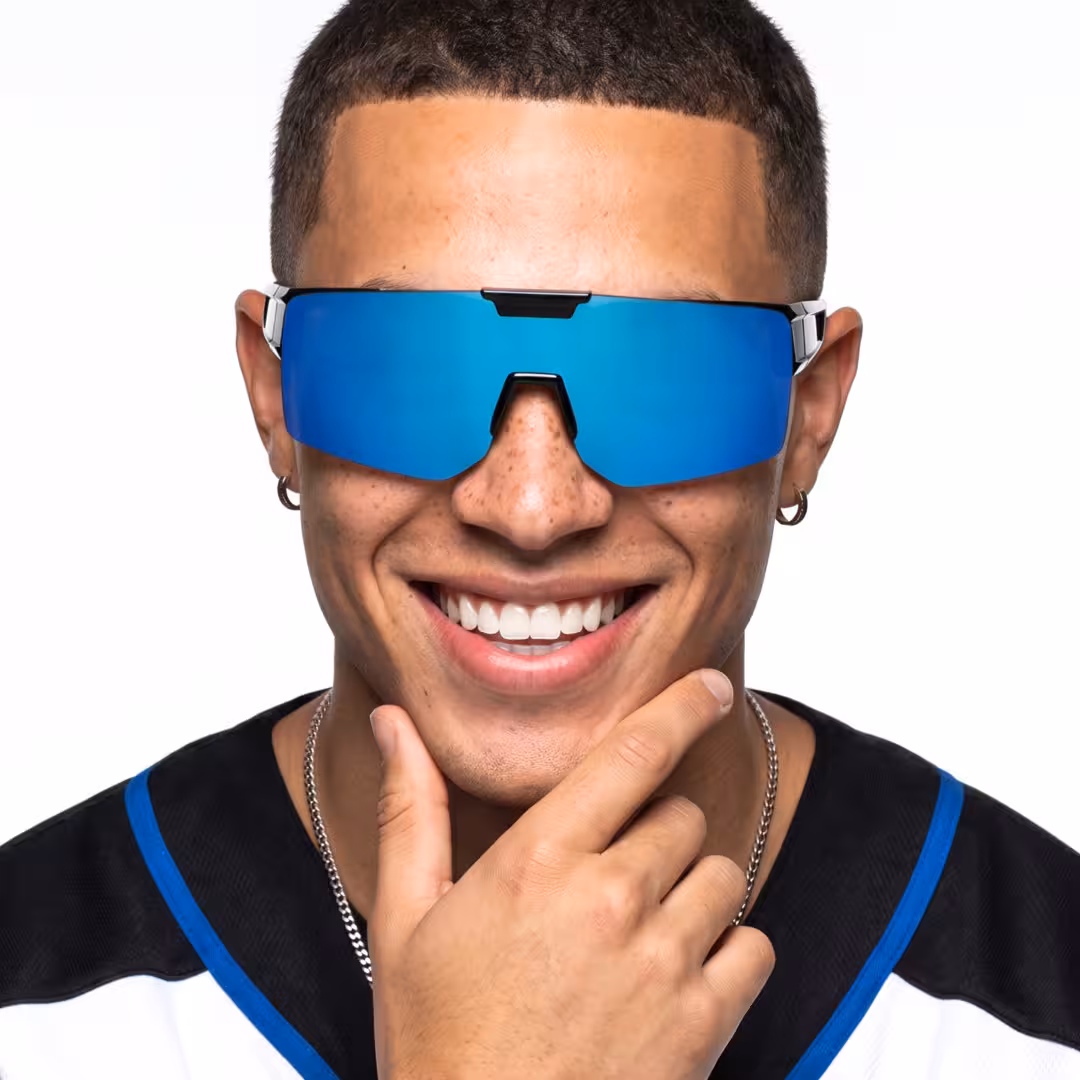 Front view of male wearing blue square flip-up sunglasses, smiling, SR0062605