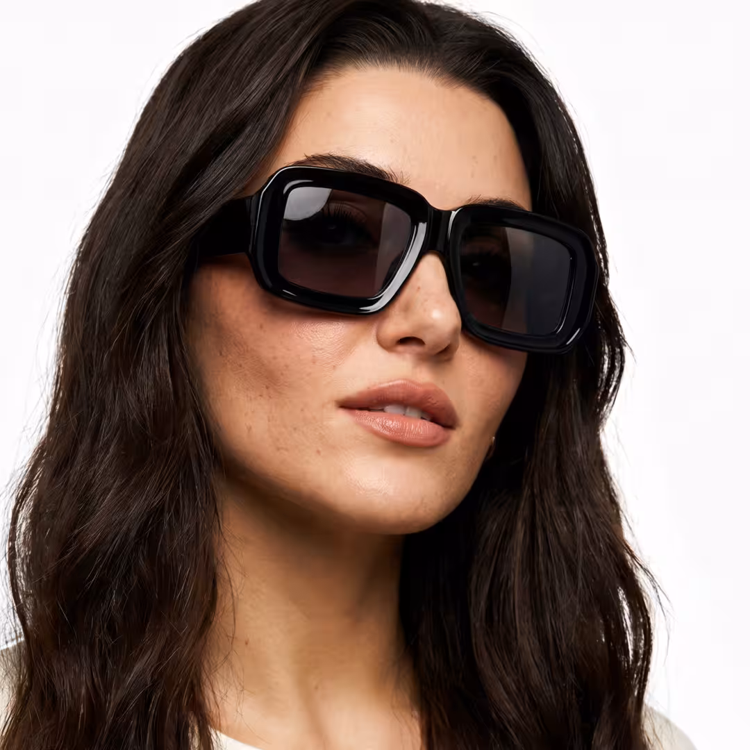 Three-quarter view of female wearing fashion black square sunglasses, soft smile, SR0092303