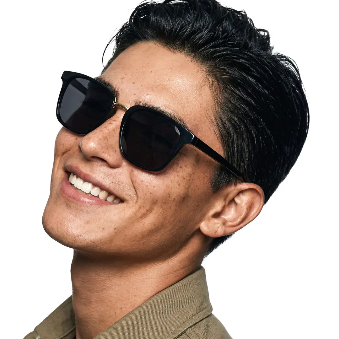 Tilted head view of male wearing black square sunglasses, smiling, SR0232308S