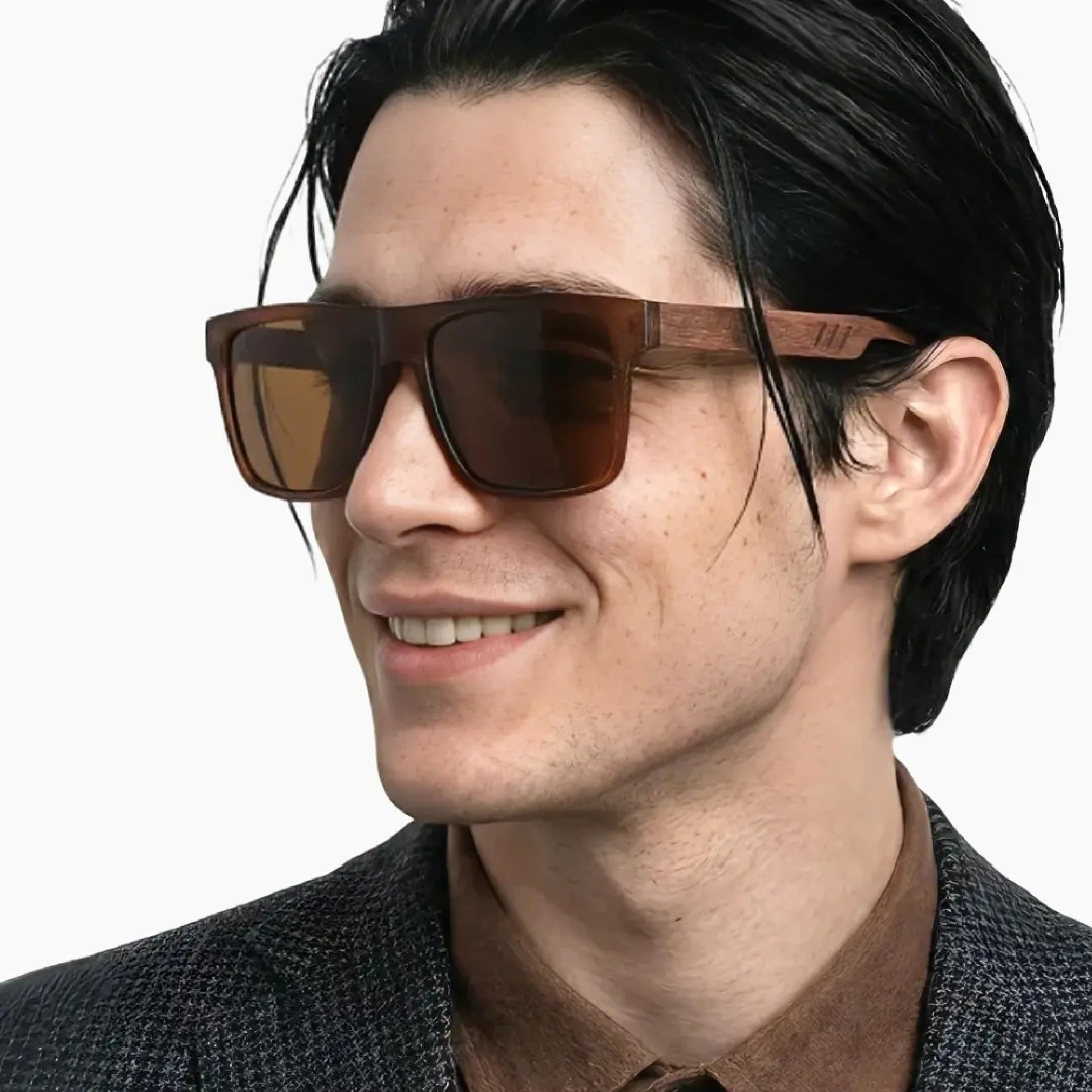 Three-quarter view of male wearing brown square sunglasses, natural smile, SX0012304