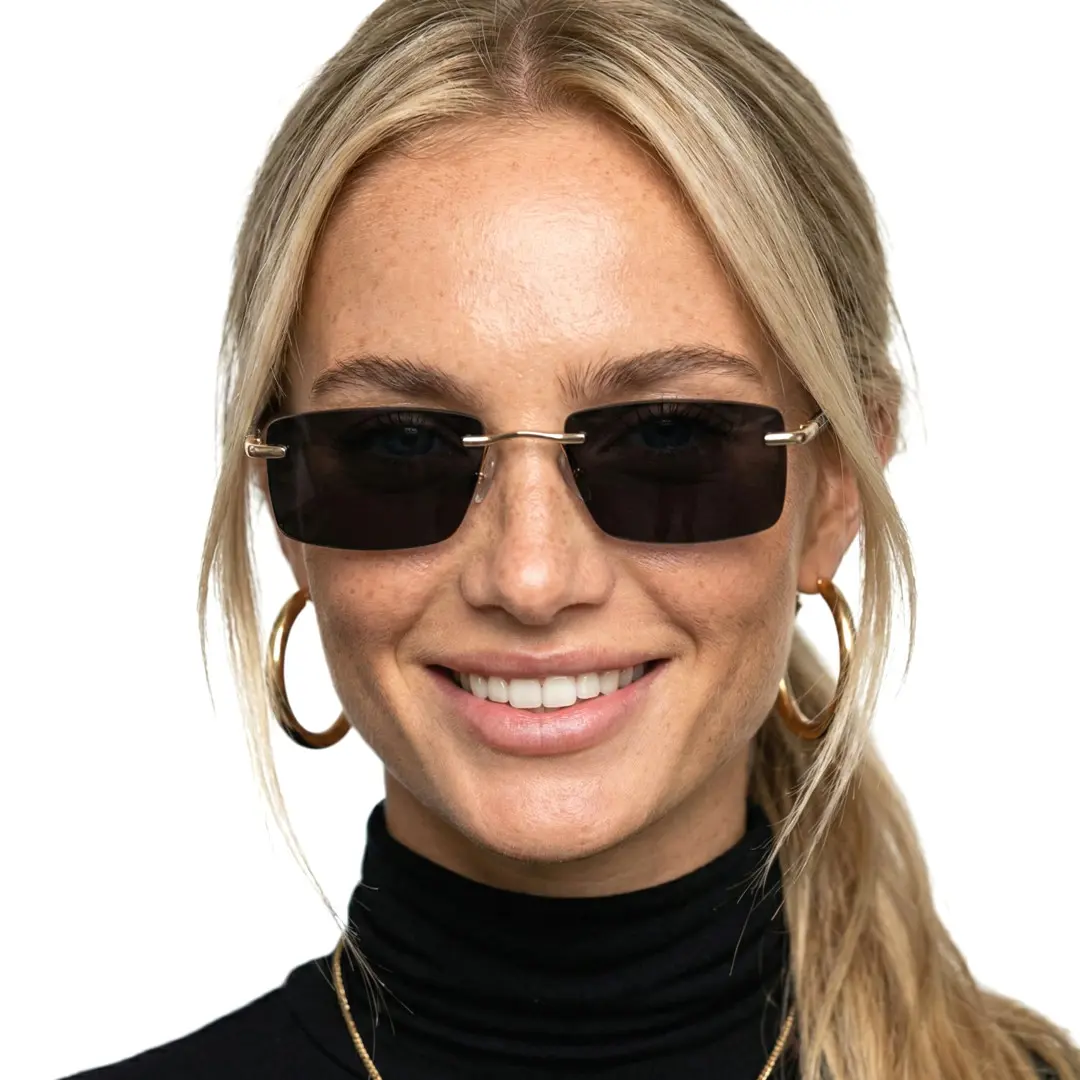 Front view of female wearing gold square sunglasses, smiling, SX0152507S