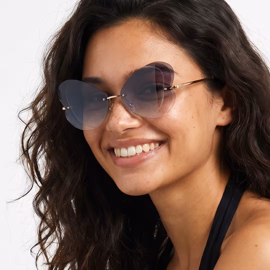 Female wearing black unique metal sunglasses, smiling. SPU: UM0102604