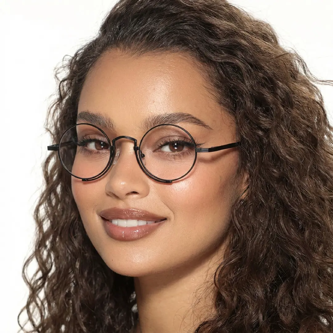 Front view of female wearing black round eyeglasses, natural smile, RT0052304