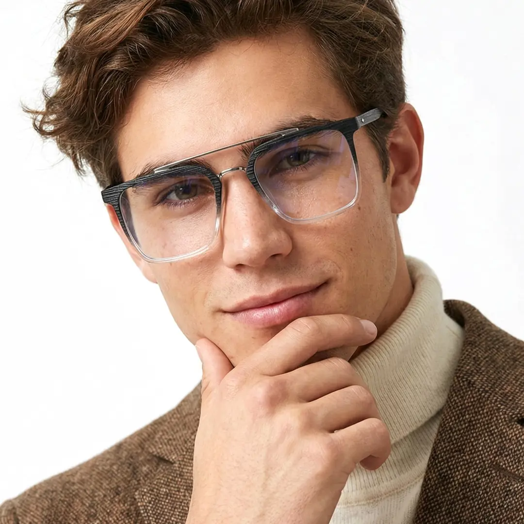 Front view of male wearing two-tone square eyeglasses, hand touching chin, soft smile, SR0222508