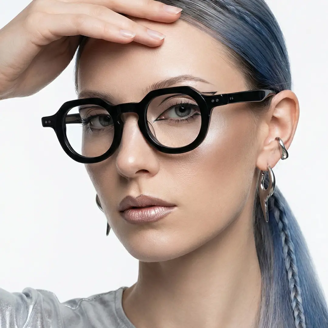 Face close-up view of female wearing vintage black geometric eyeglasses, hand resting on forehead, neutral expression, GA0032301