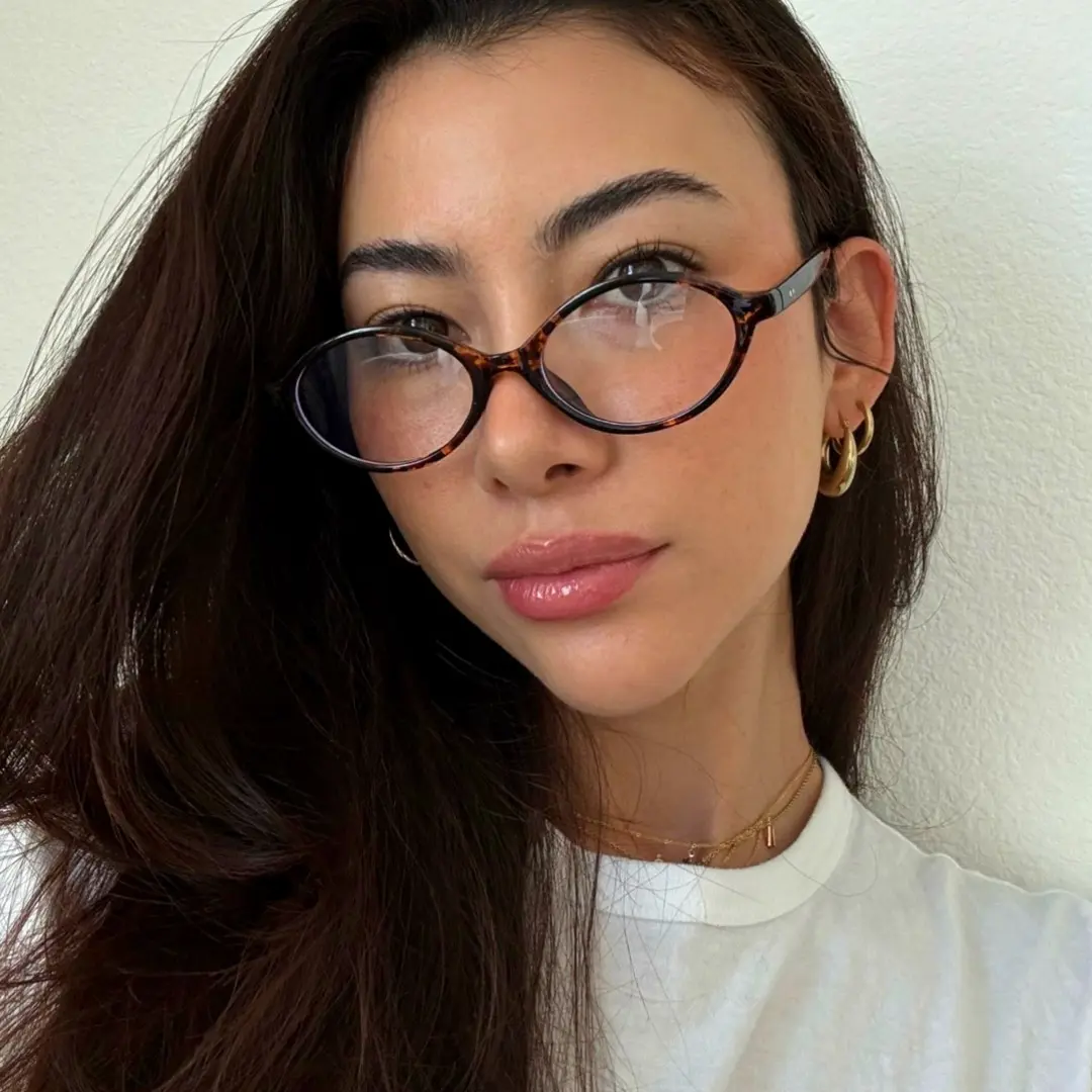 Front view of female wearing tortoise oval eyeglasses, confident expression, FS-OR0312402