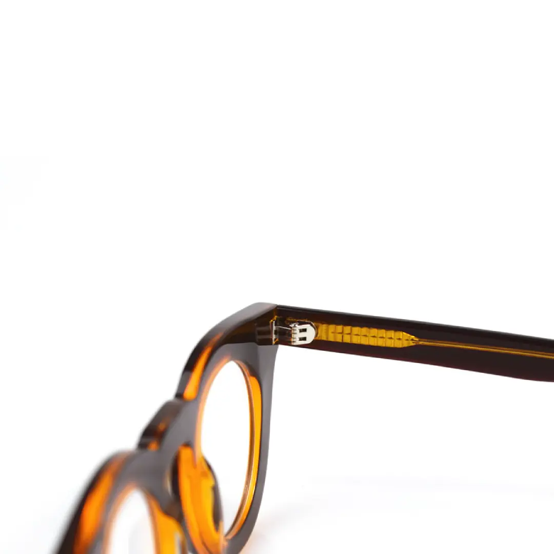 Spring hinge detail of Jax round acetate eyeglasses RA0182406 in brown