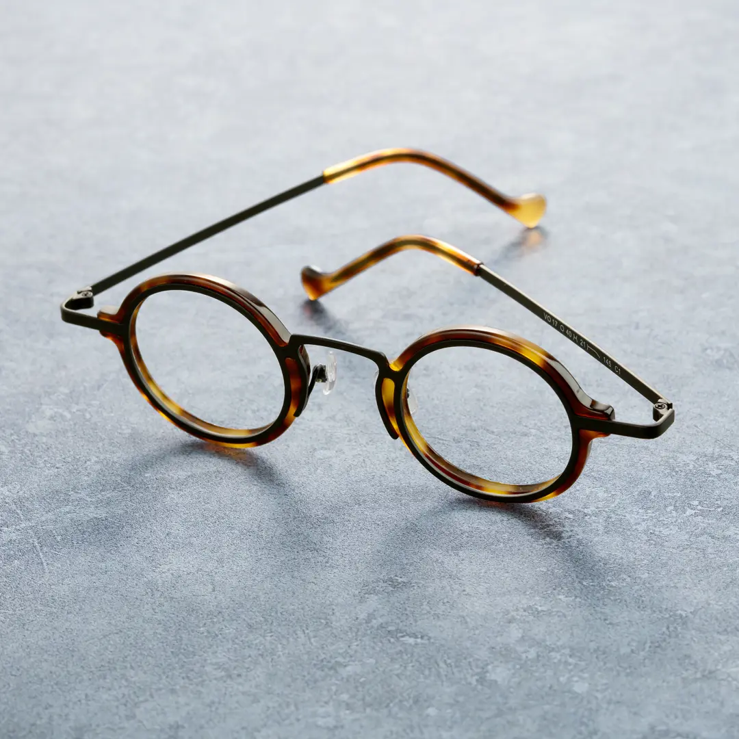 Scene close-up view of Kyire vintage round acetate eyeglasses in tortoise. SPU: RA0302402