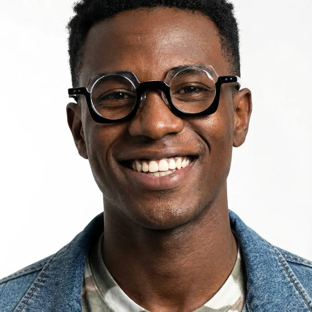 Front view of male wearing black unique eyeglasses, smiling, UA0052302