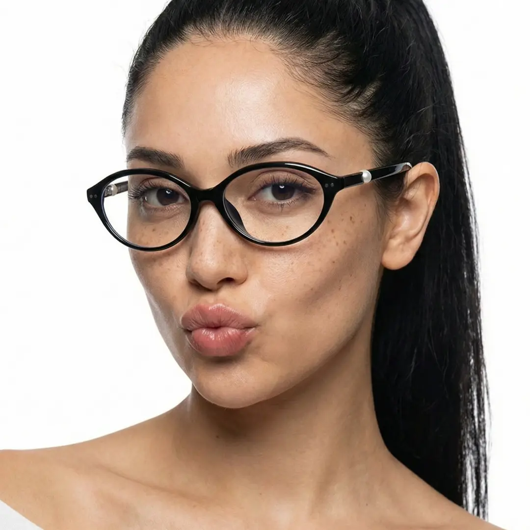 Face close-up view of female wearing black oval eyeglasses, pouting, natural smile, OR0192509