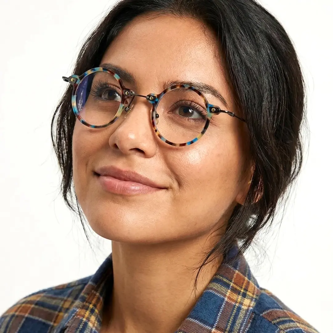 Looking away view of female wearing steampunk blue tortoise round eyeglasses, natural smile, RT0302406