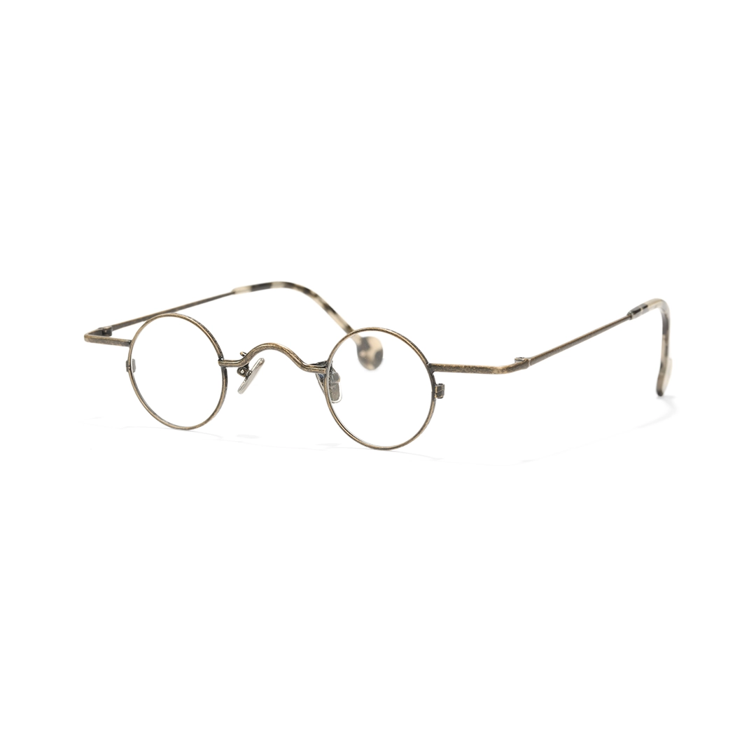Angle view of Xen round metal eyeglasses RM0242601 in bronze